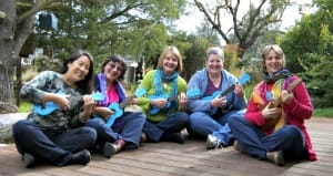 Group of unschool moms playing ukulele