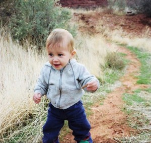 dale Stephens as a baby beginning walking on a hiking trail.