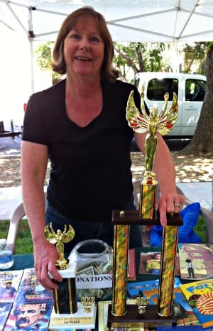 Volunteer with Winters Friends of the Library Youth Day Parade Trophy